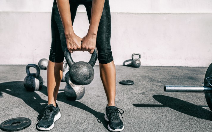 women holding a kettlebell